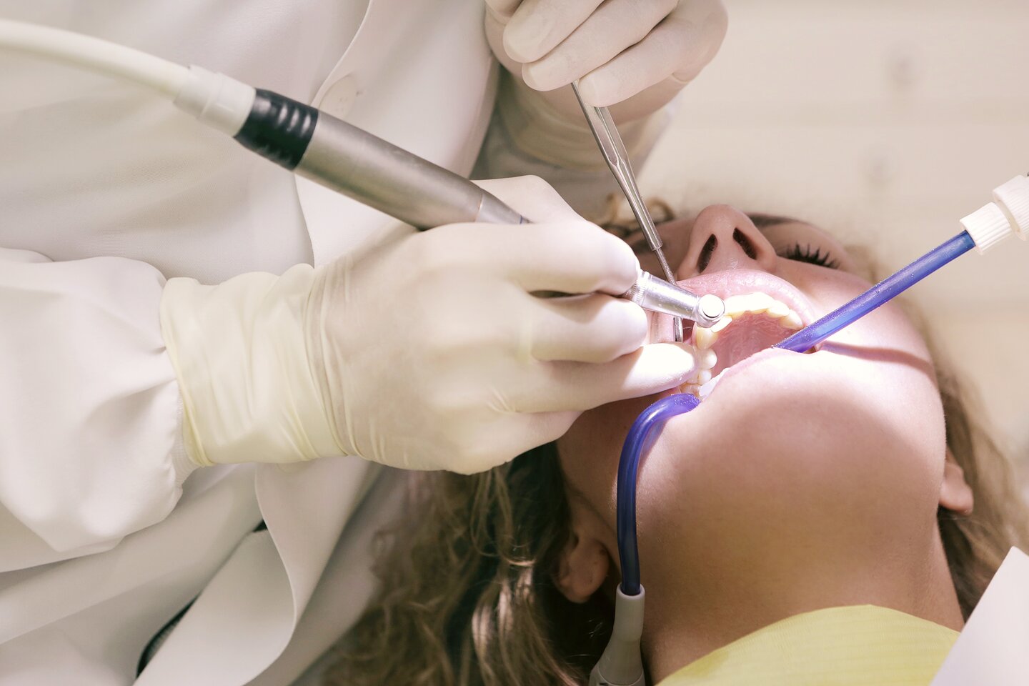dentist working on a woman's teeth