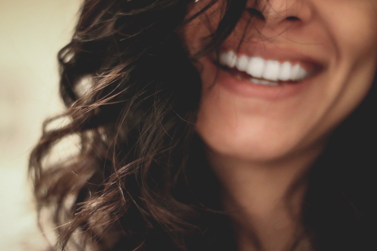 smiling woman with brown hair