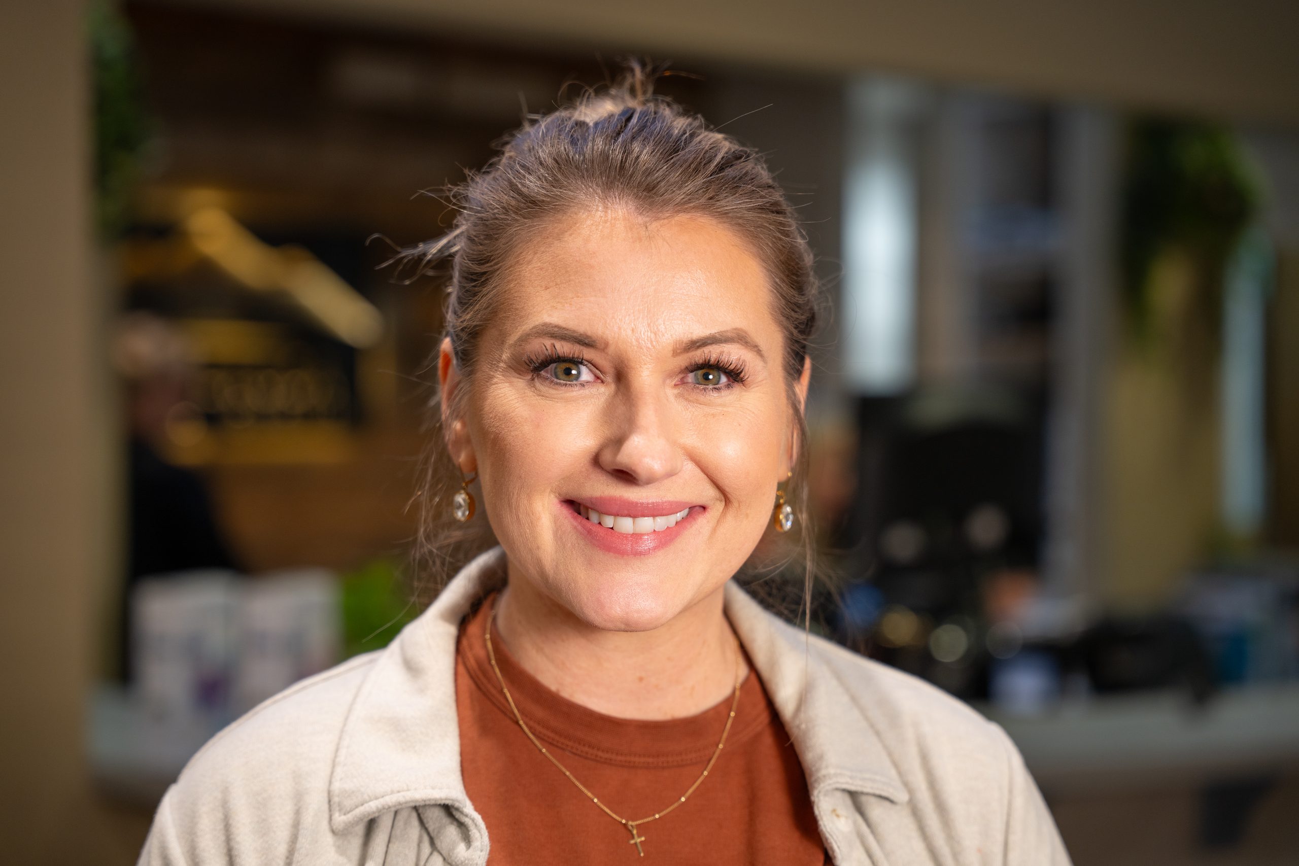 woman smiling brightly into camera